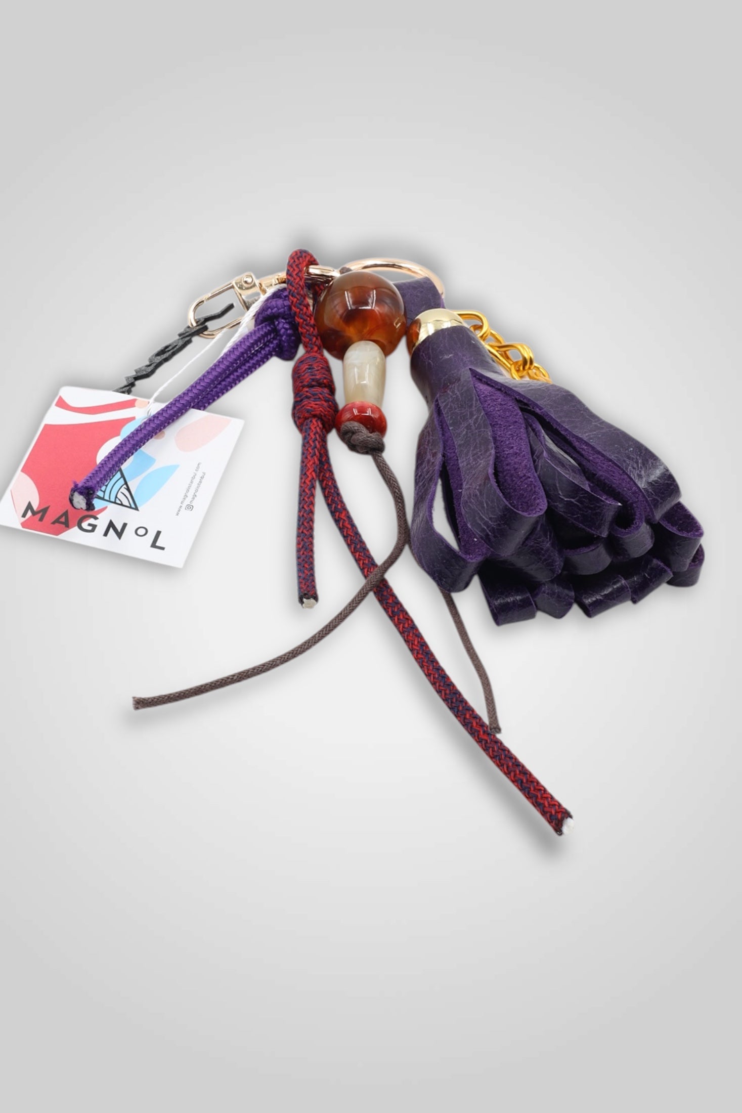 LEATHER TASSEL BAG CHARM - PURPLE
